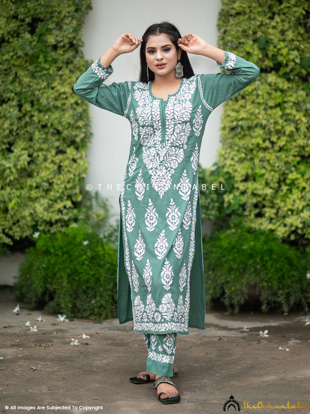 Woman in green modal cotton chikankari kurta set