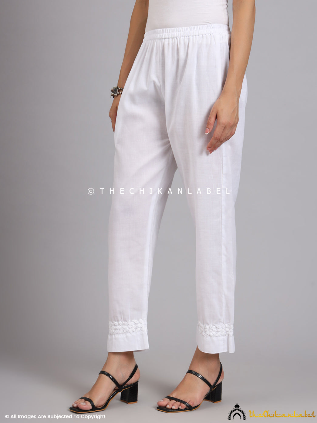 Nira straight pants styled with black heels