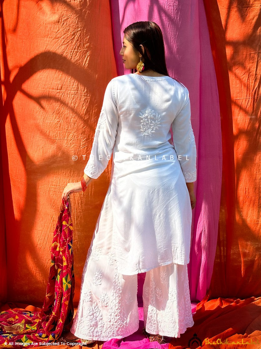 White rayon chikankari set displayed on hanger for product focus