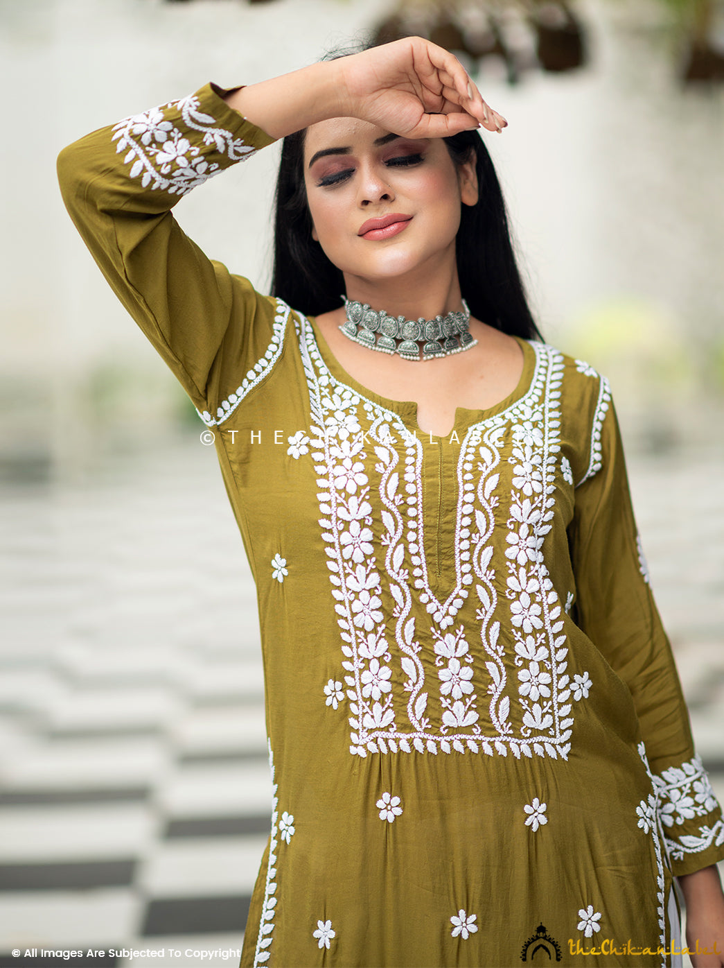 Artisan-crafted green kurti with hand embroidery detailing