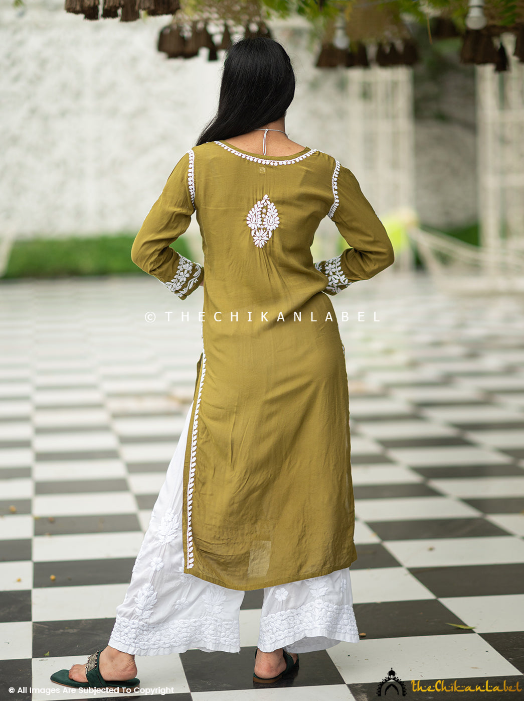Model in traditional chikankari kurti styled with oxidised choker