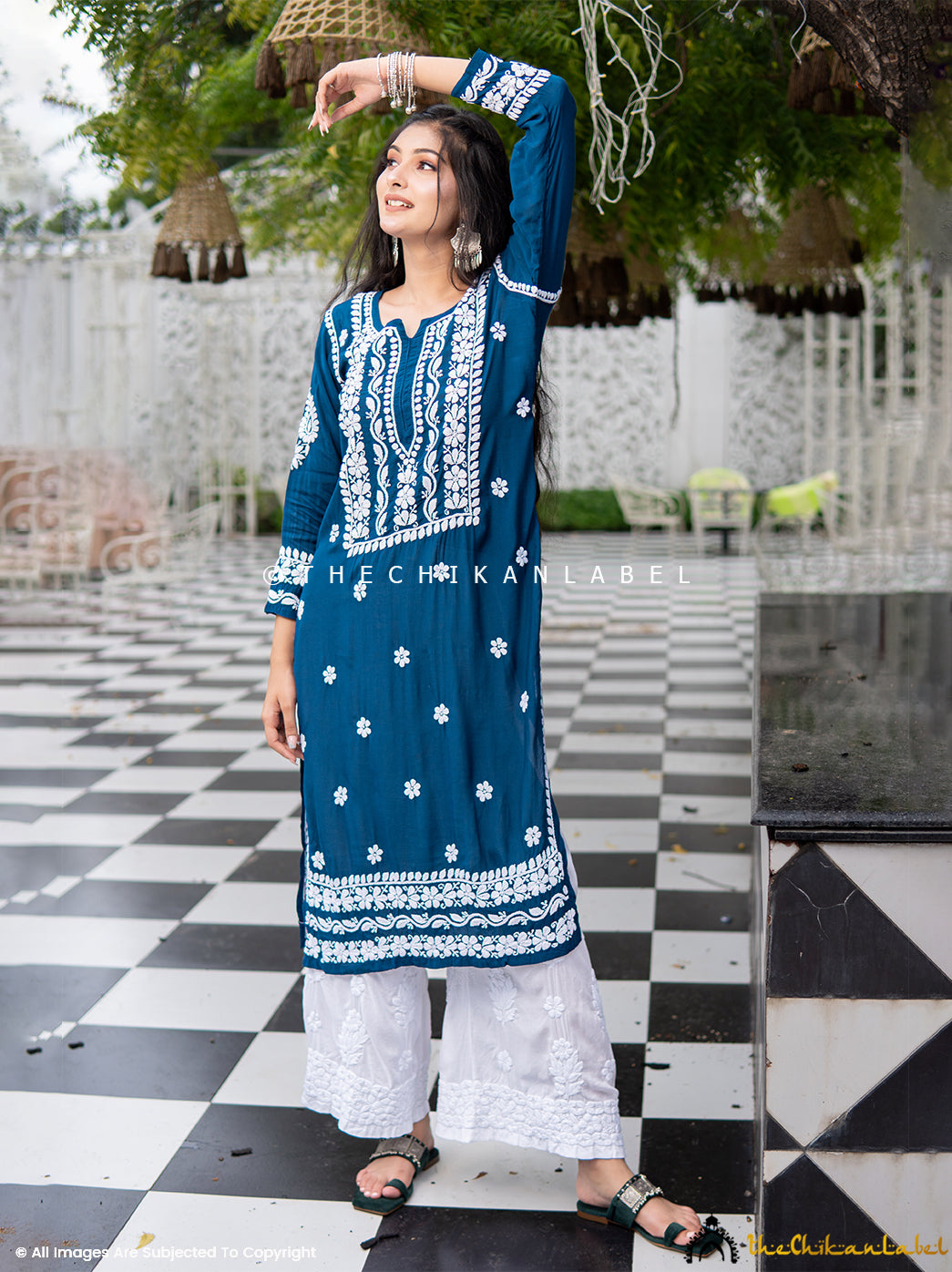 Artisan-made blue kurti featuring classic white threadwork