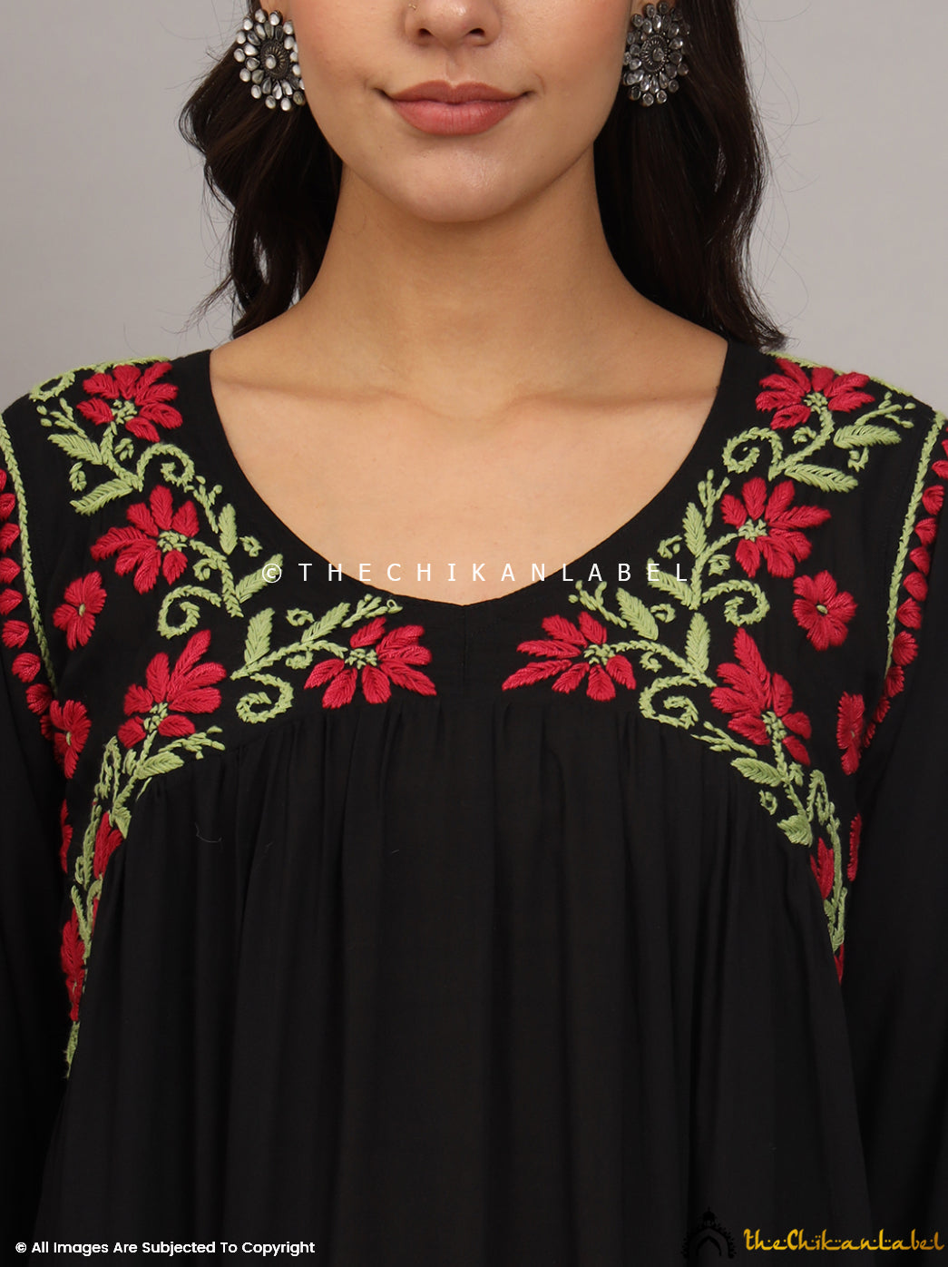 Features vibrant multicolored floral chikankari embroidery in red and green