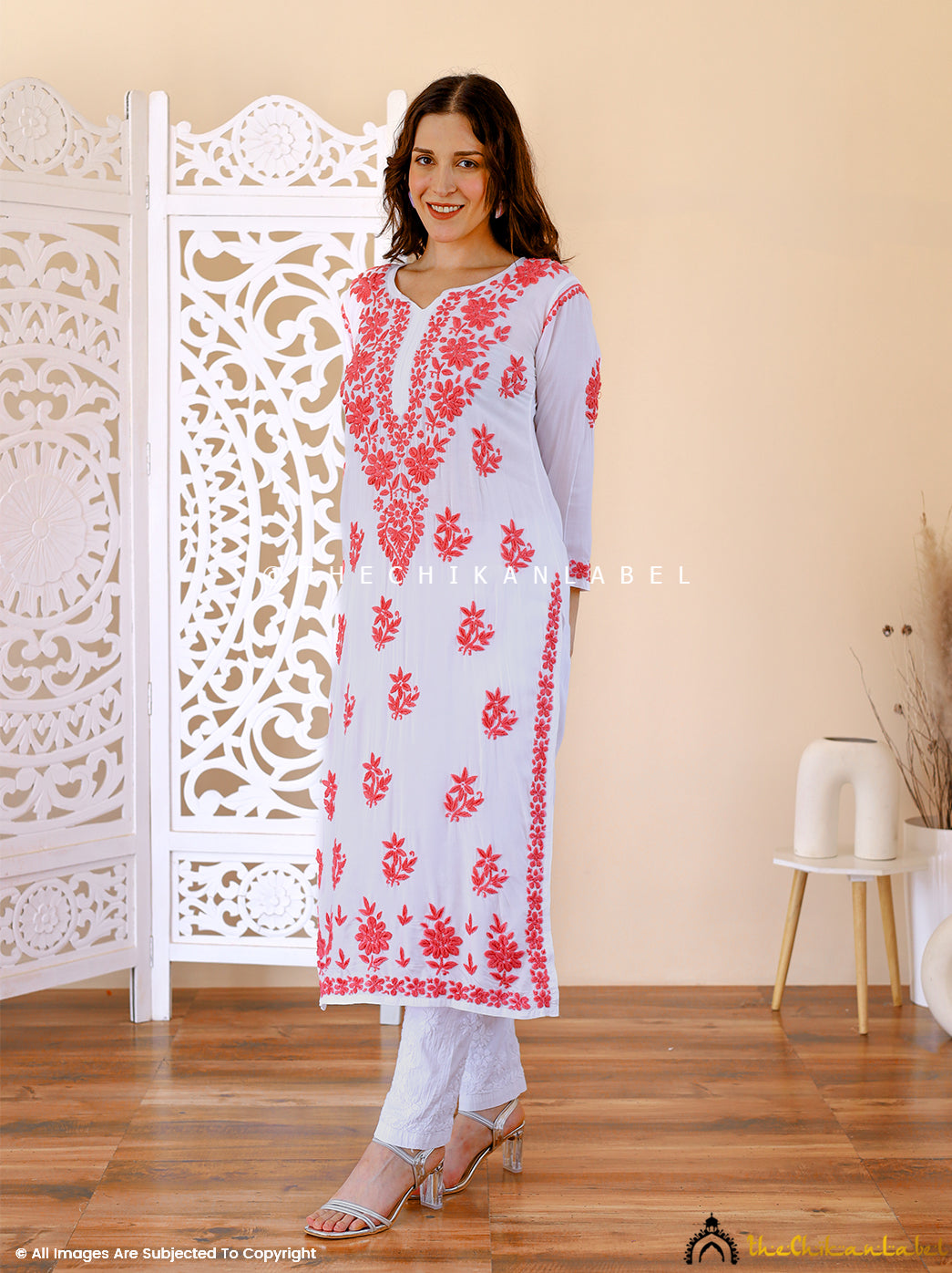 Three-quarter sleeve kurti with bold red floral patterns