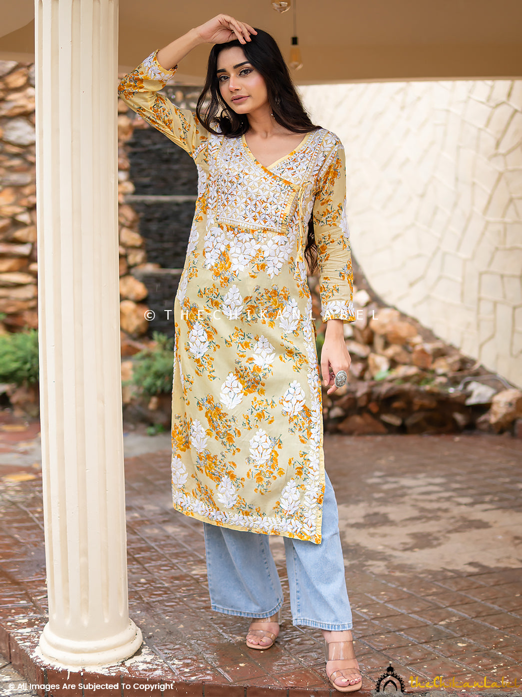 Front view of yellow kurti featuring floral print and white embroidery