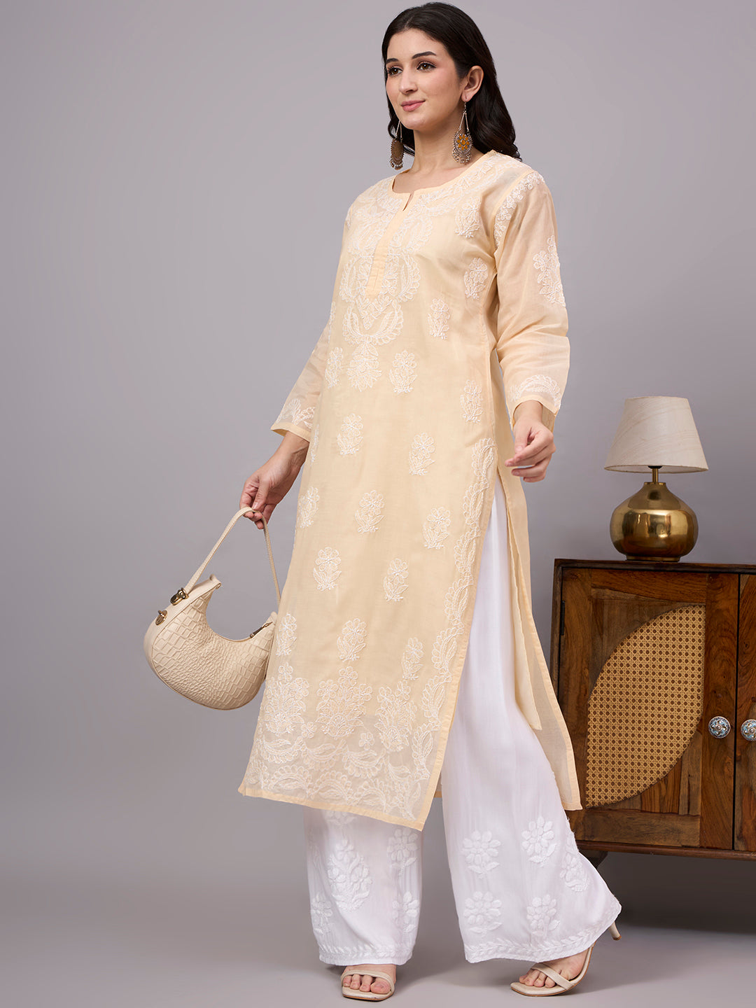 Comfortable regular wear Chikankari Kurta made from premium cotton fabric with handcrafted embroidery and an attached inner for enhanced comfort and coverage.