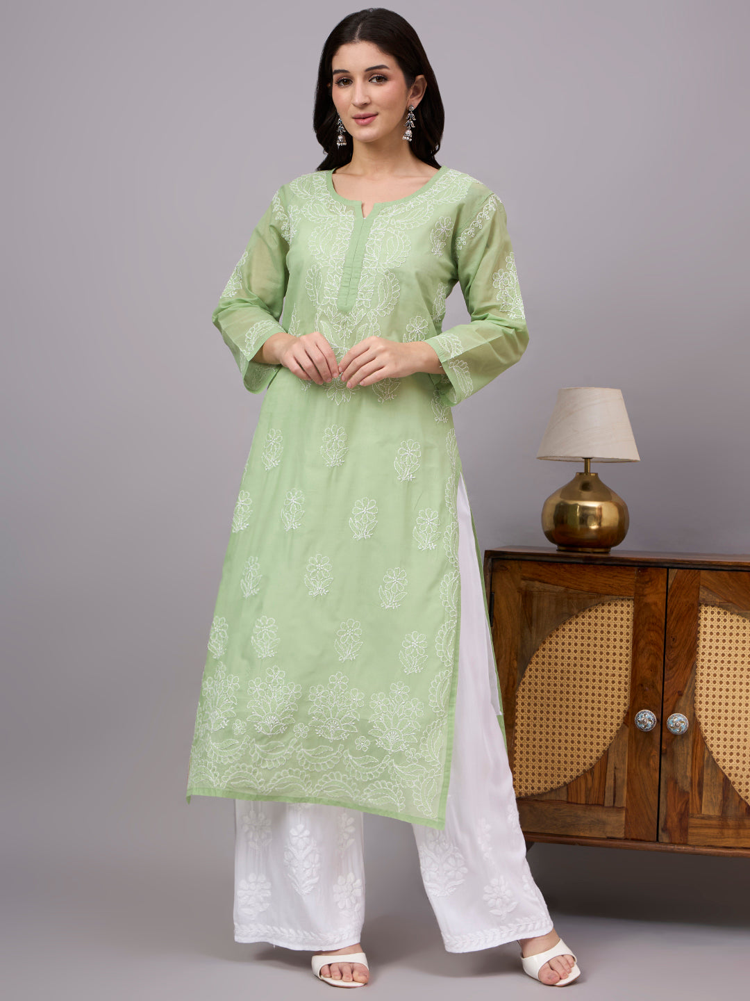 Authentic Cotton Straight Kurti designed with handcrafted floral Chikankari embroidery, breathable fabric, and an attached inner for all-day comfort.