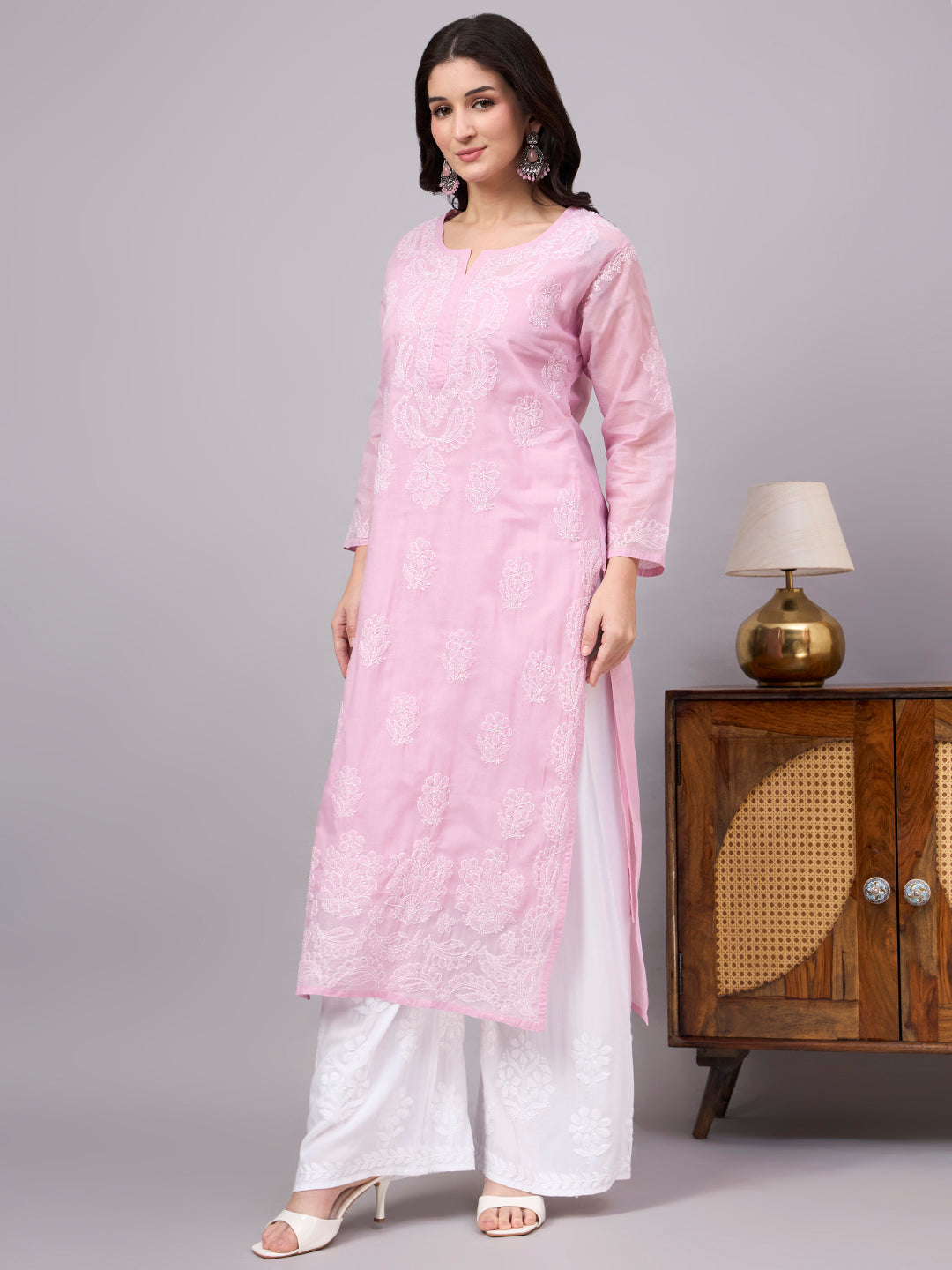 Women's handcrafted Cotton Straight Kurti with authentic floral Chikankari embroidery, comfortable regular fit, and breathable fabric for daily wear and festive occasions.