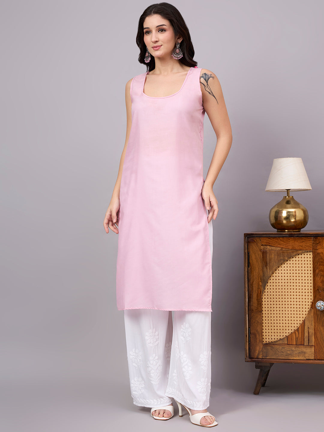 Women's trending kurti featuring handcrafted Lucknow Chikankari embroidery, premium cotton construction, soft inner lining, and elegant straight-fit styling.