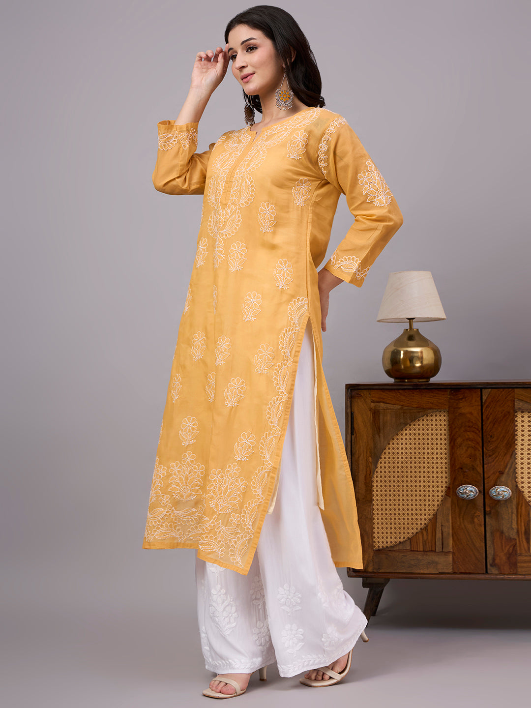 Women's handcrafted Cotton Straight Kurti with authentic floral Chikankari embroidery, comfortable regular fit, and breathable fabric for daily wear and festive occasions.