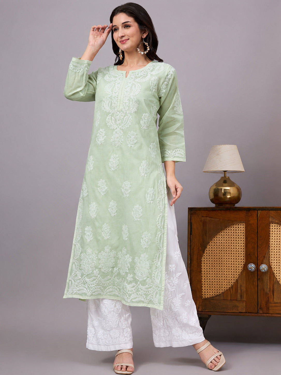Women's handcrafted Chikankari Kurta made from breathable cotton fabric with detailed artisan embroidery and a comfortable regular fit for every occasion.