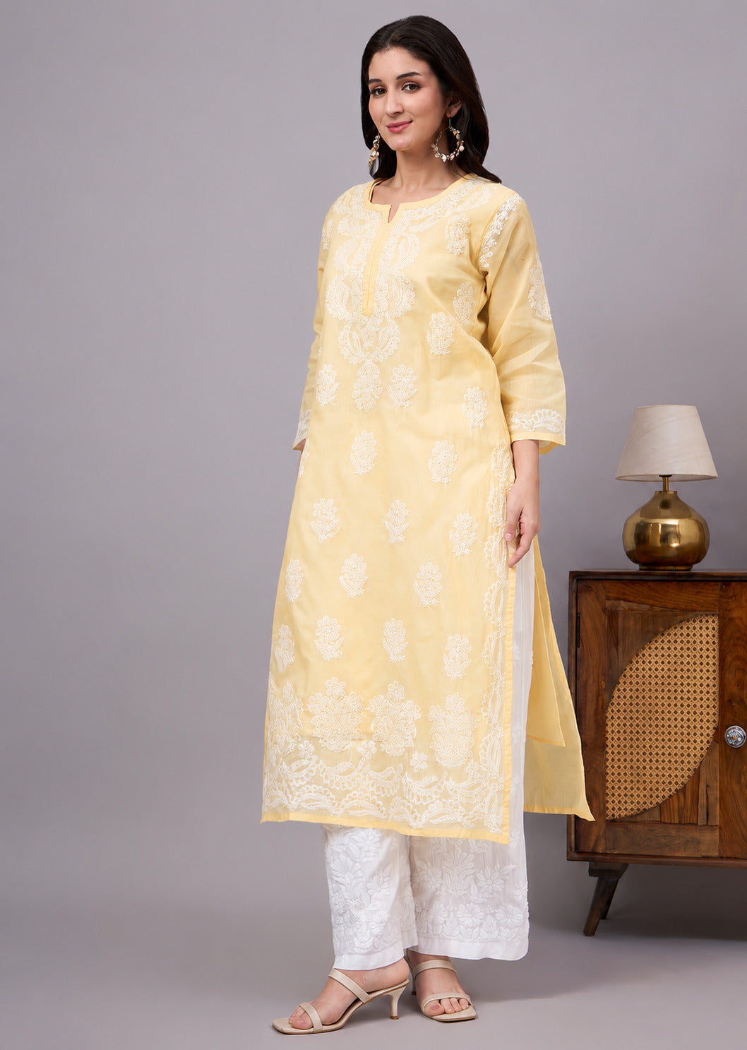 Authentic Cotton Straight Kurti designed with handcrafted floral Chikankari embroidery, breathable fabric, and an attached inner for all-day comfort.