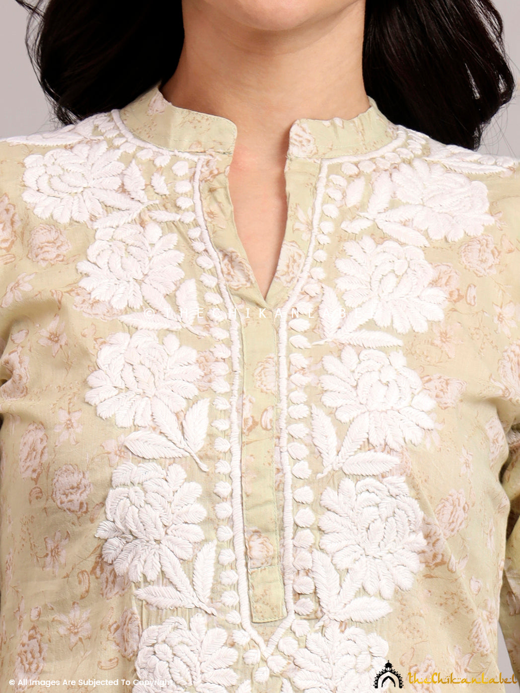 Trending short kurta styled with minimal accessories and white lowers, ideal for casual and everyday ethnic looks