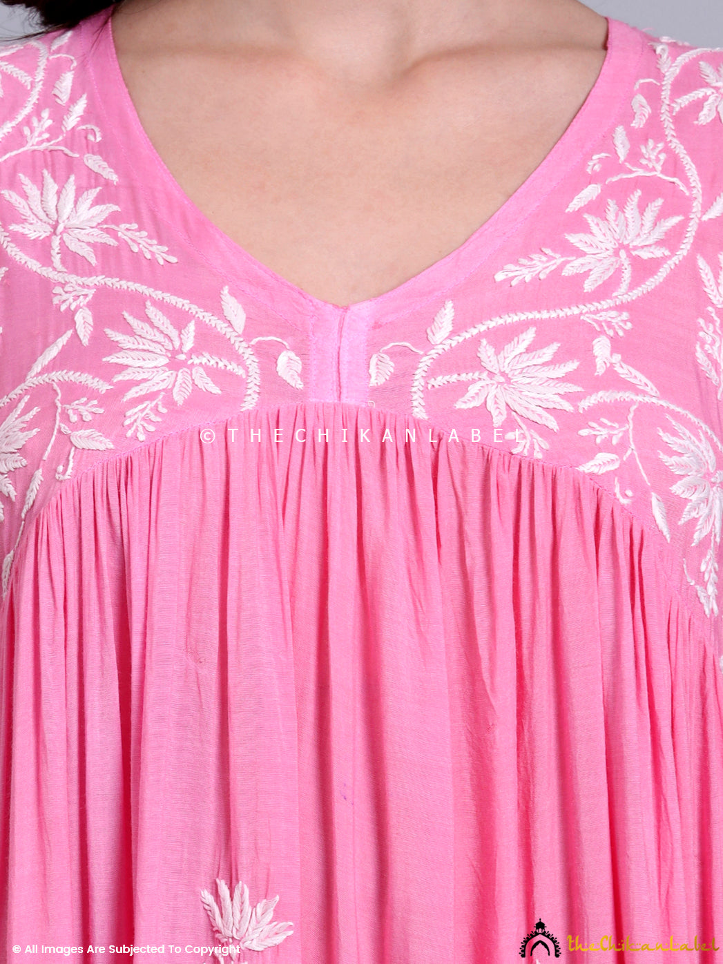 Front view of a model wearing a handcrafted Anarkali kurta in soft muslin fabric with traditional Chikankari work.