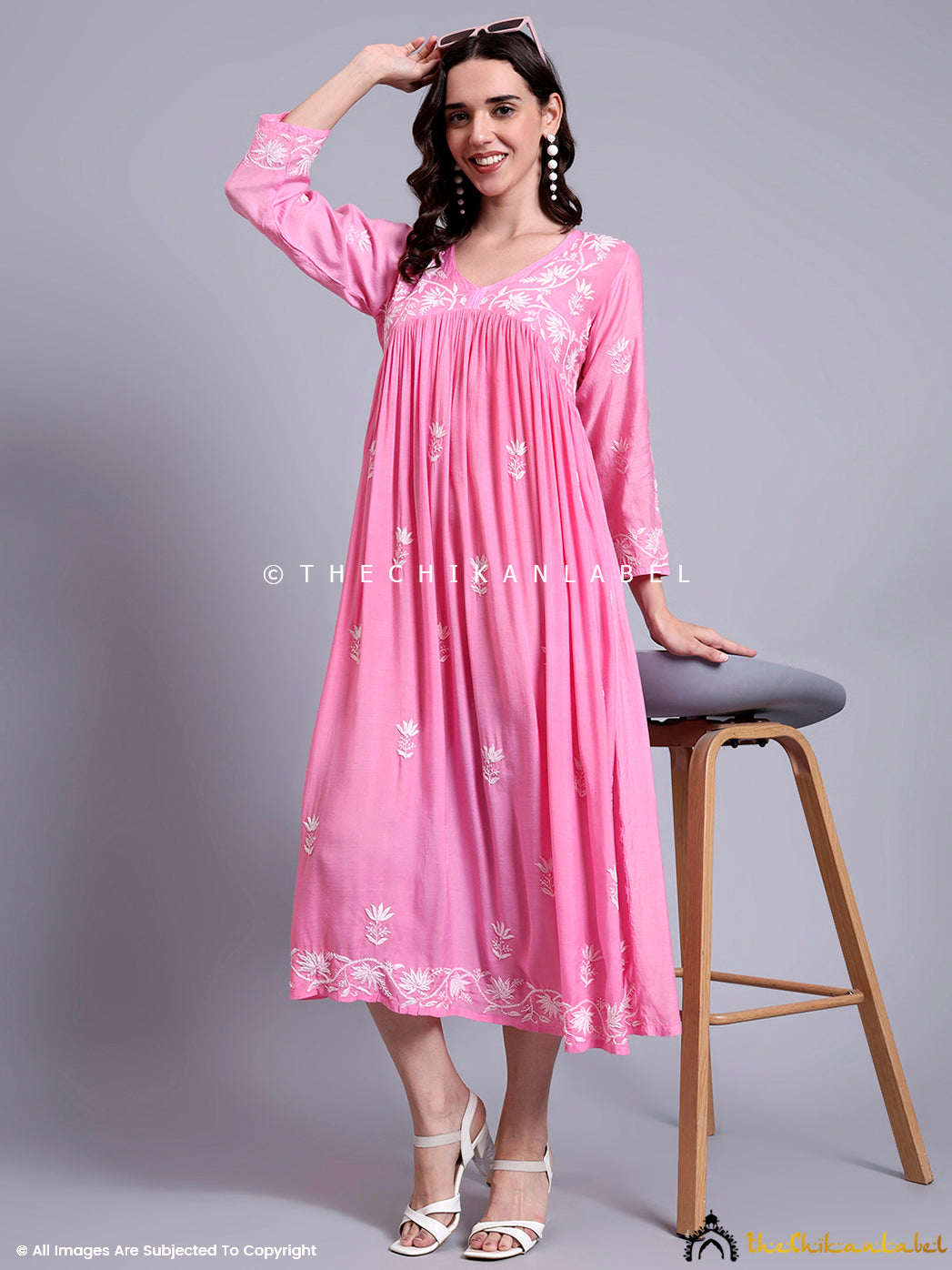 Stylish muslin Anarkali kurti with long sleeves and embroidered borders for a graceful Indo-western look.