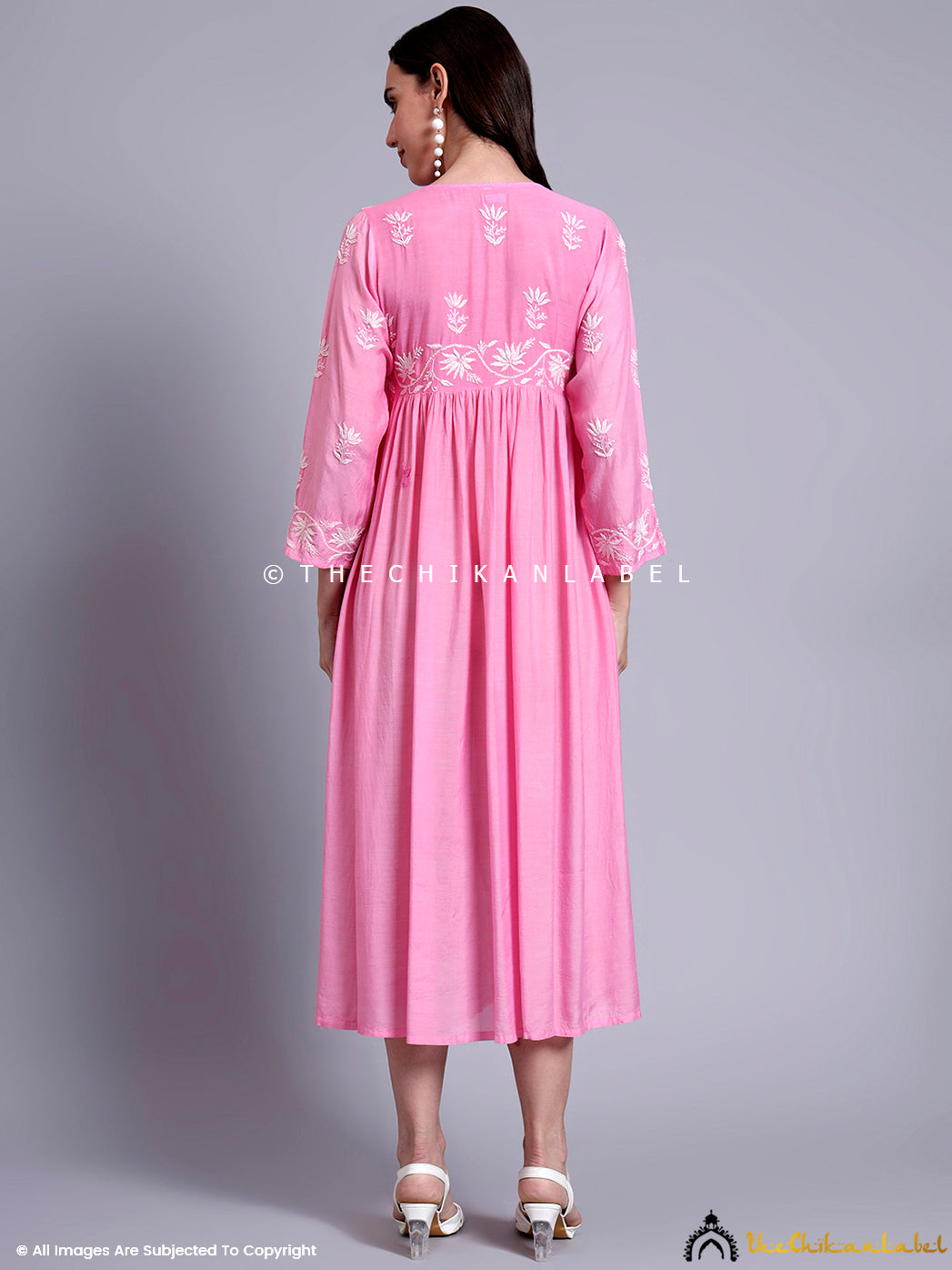 Long flared Anarkali-style kurta with floral Chikankari embroidery and delicate sleeve detailing.