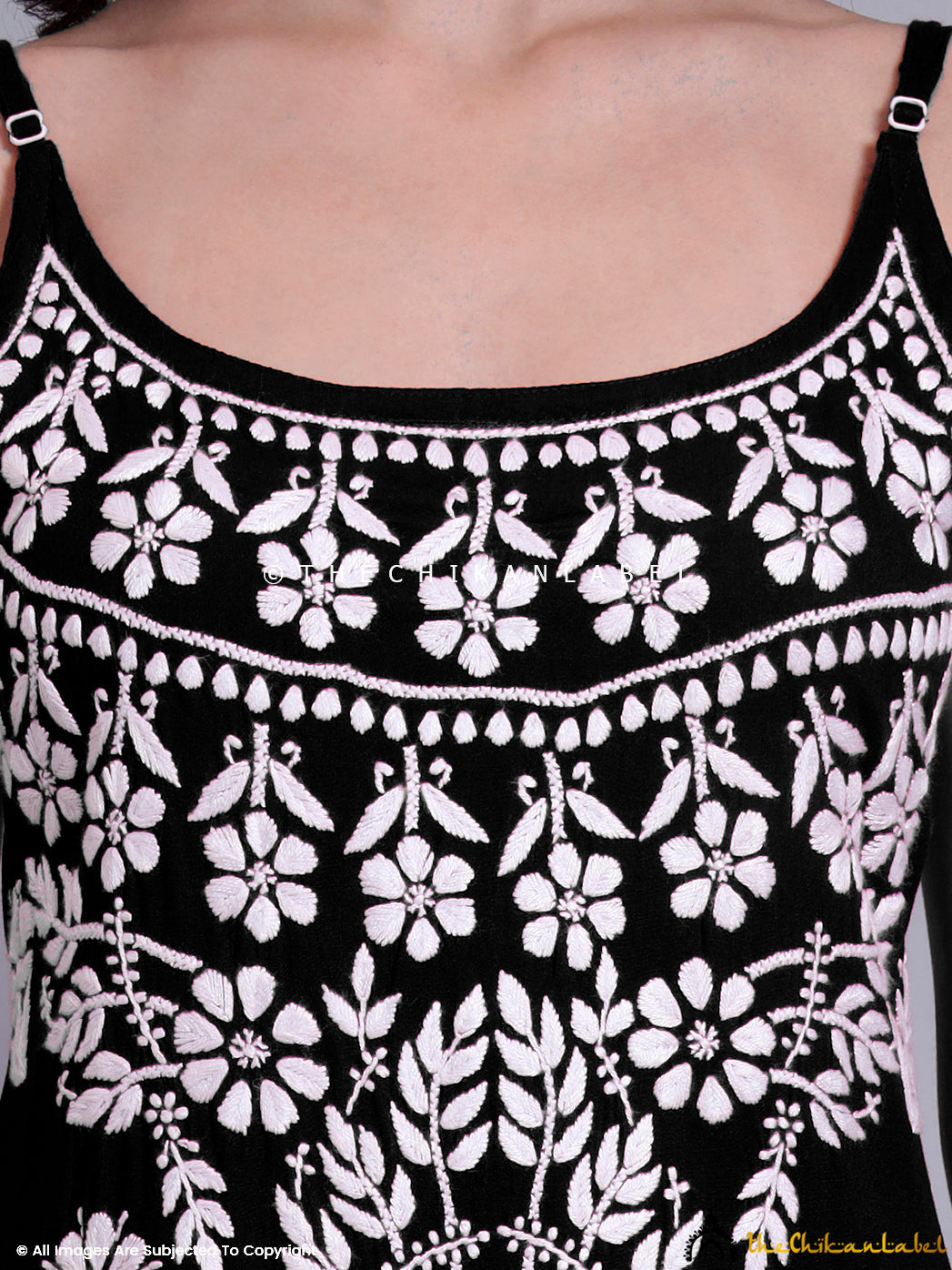 Sleeveless Indian kurta designed in modal fabric with heritage chikankari thread motifs and a flattering modern fit.