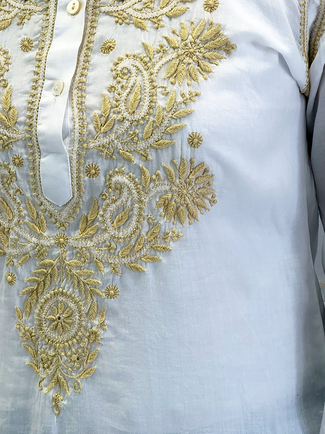 Handcrafted chikankari shirt made from soft mulmul cotton with detailed embroidery on the neckline and yoke