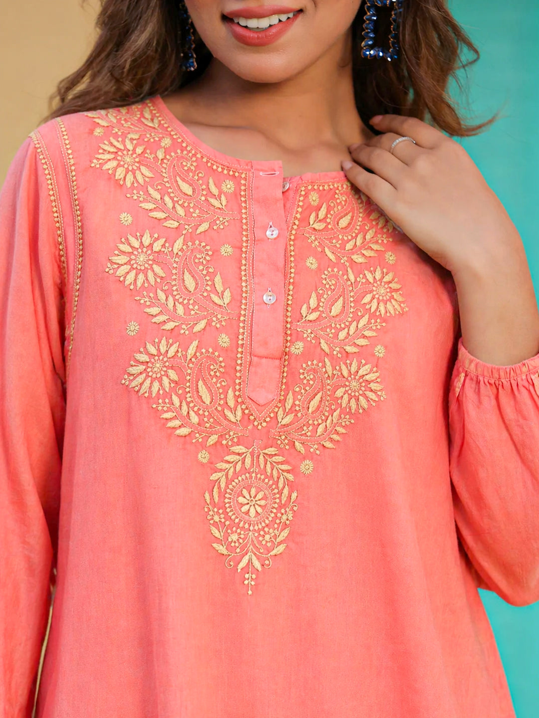 Premium cotton chikankari kurti with fine shadow work embroidery, round neck with button placket, and minimalist straight cut perfect for office wear and daily styling.