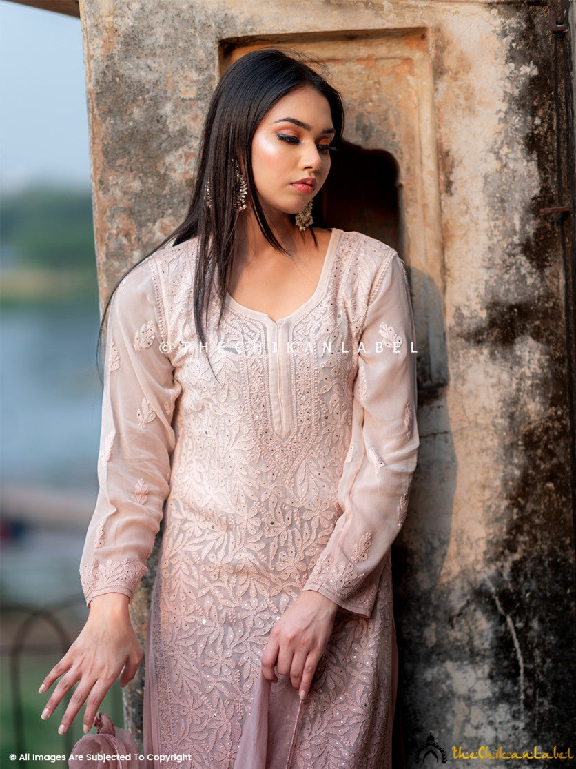 Traditional mukaish and chikankari work on viscose kurti set worn for ethnic gatherings and weddings.