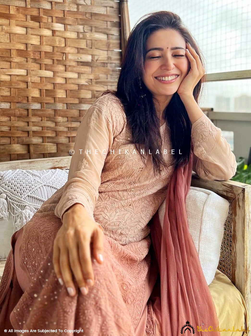 Model in elegant viscose chikankari kurti palazzo set with mukaish work, styled with matching dupatta for luxurious ethnic wear.