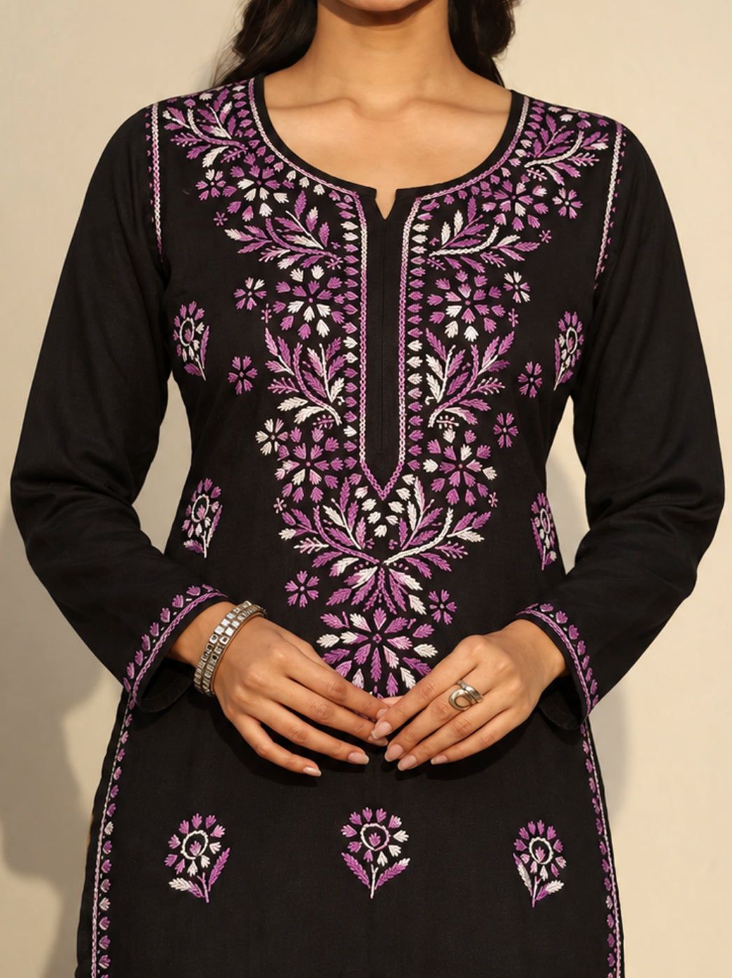 The Chikan Label Ayra Rayon Straight Kurti with leafy vines and floral embroidery across the upper front, smaller motifs below and decorative borders along the long straight hem.