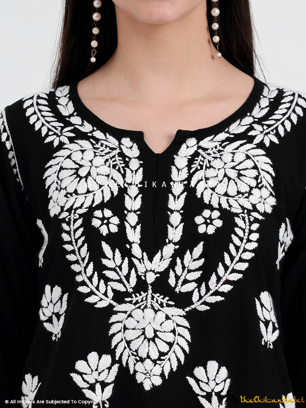 Fashion blogger-approved chikankari short top featuring floral threadwork and flattering cut, ideal for daily fashion and reels.