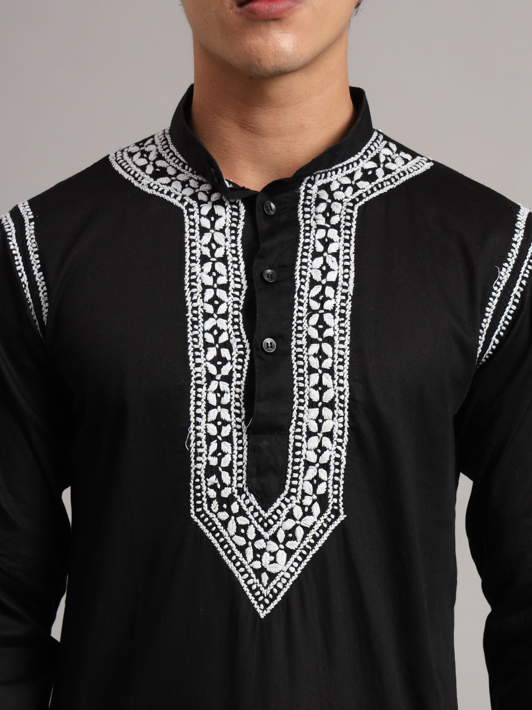 Front view of the Uman Mens Kurta showing a straight silhouette, full sleeves and an embroidered neckline extending into a pointed decorative panel across the chest.