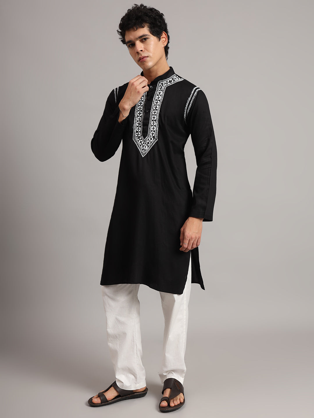 Full-length view of the Uman Mens Kurta highlighting its knee-length design, straight hem, side slits and full sleeves, styled with simple trousers.