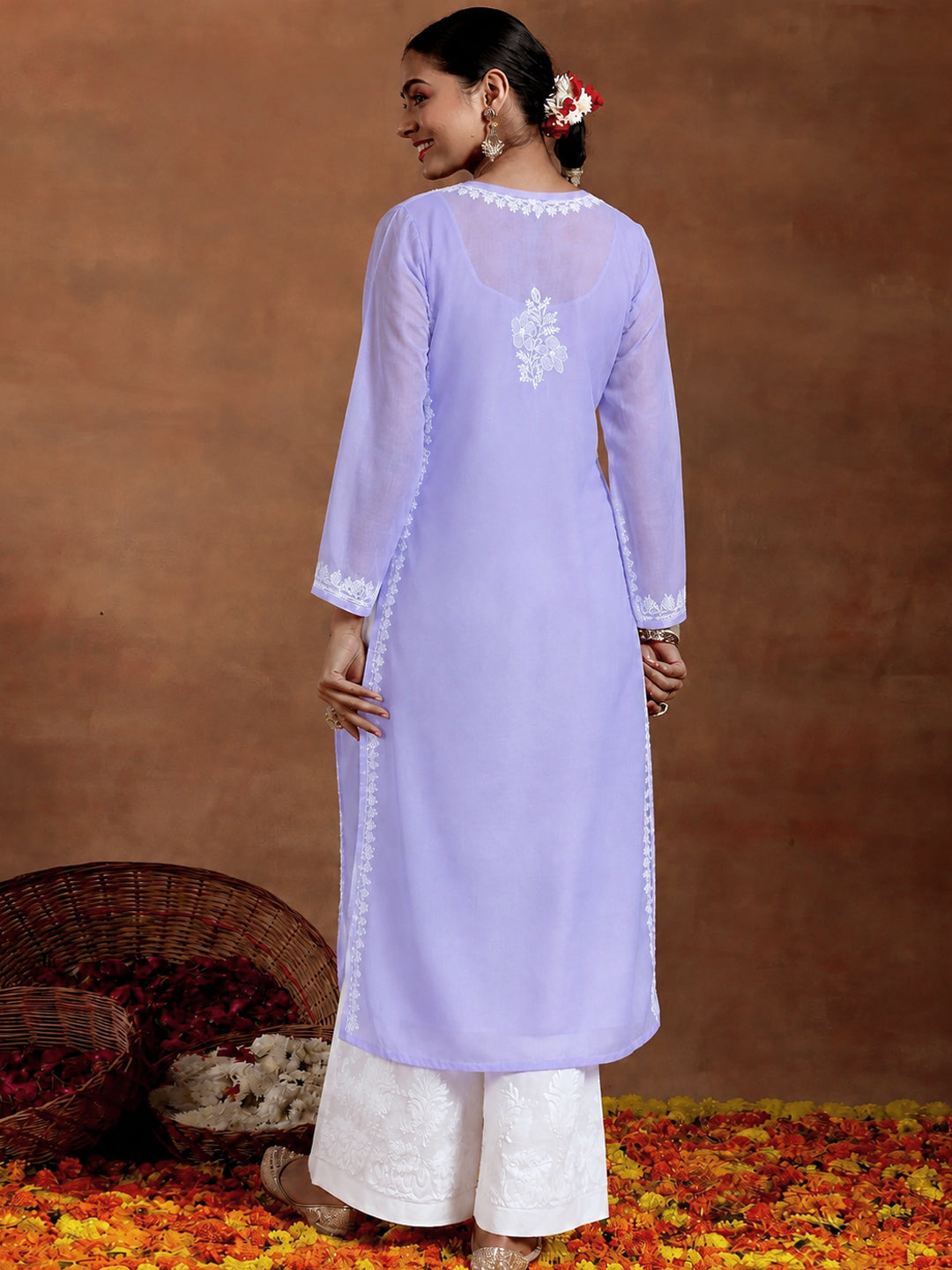 Trending straight Chikankari kurti for women crafted in soft breathable cotton with intricate embroidery and an inner for comfortable regular and office wear.