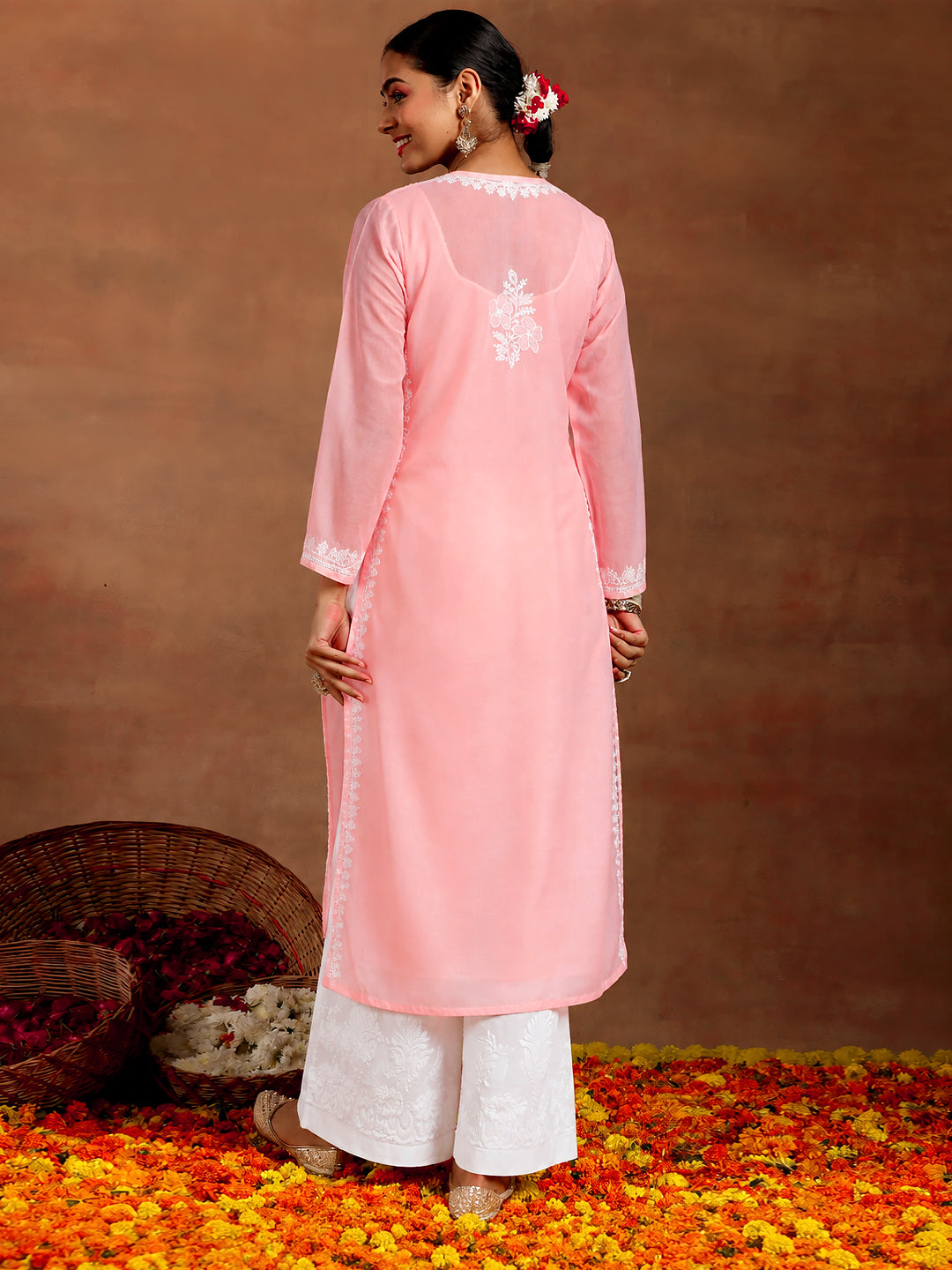 Comfortable Chikankari straight kurta for women with an inner, detailed floral embroidery and breathable cotton fabric suitable for daily wear and casual occasions.