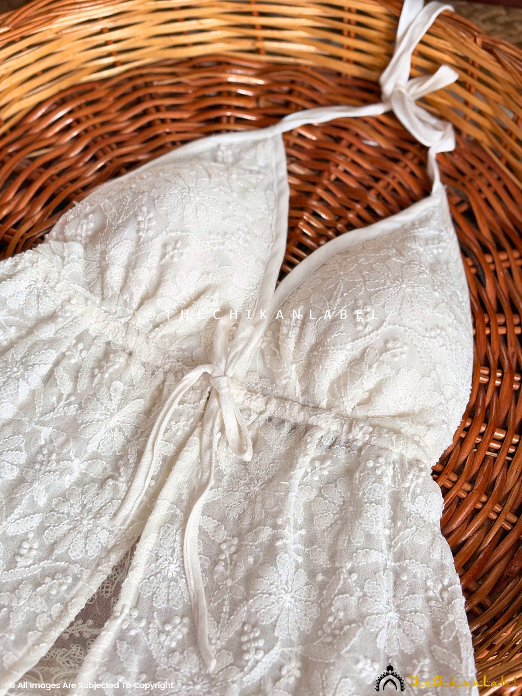 Artisan-made beach wear top featuring traditional Chikankari work on breathable georgette fabric.