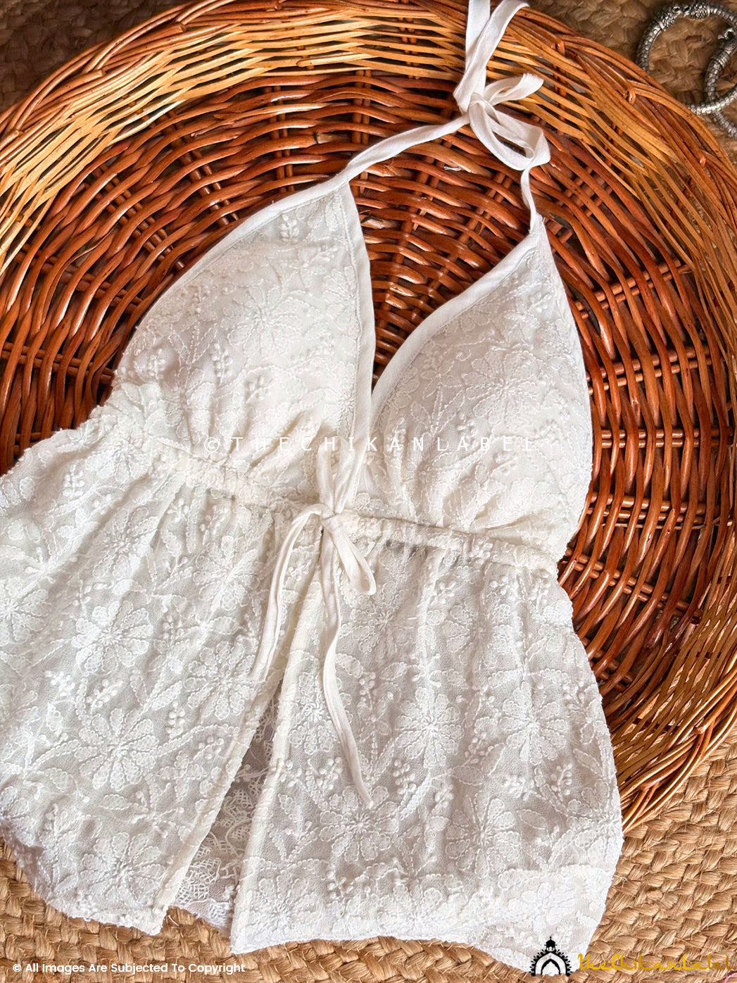 Boho-style georgette Chikankari top perfect for beach holidays with halter neckline and tie-back design.