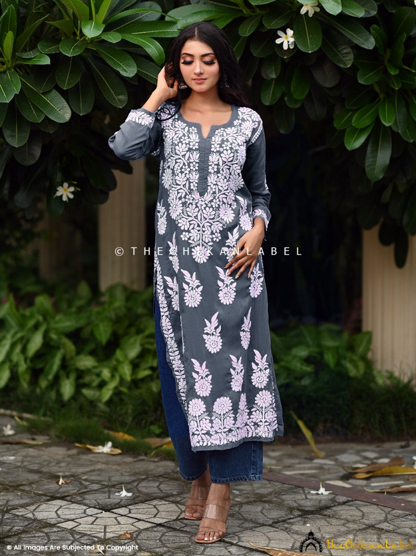 Woman wearing grey chikankari kurti with white embroidery