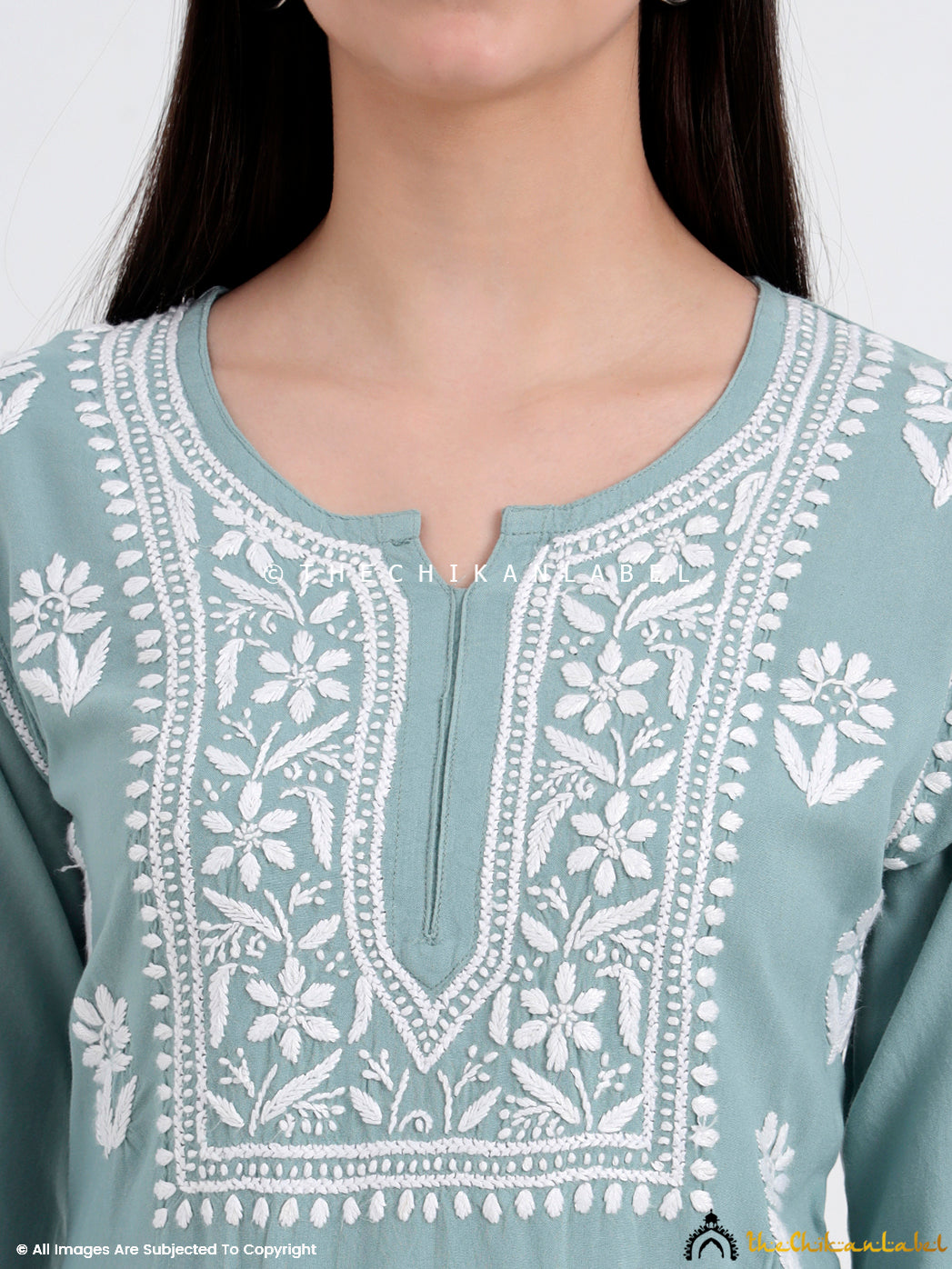 Detailed neckline view of a viral chikankari short top showing white threadwork on rayon base, handcrafted for all-day comfort and minimalist ethnic flair.
