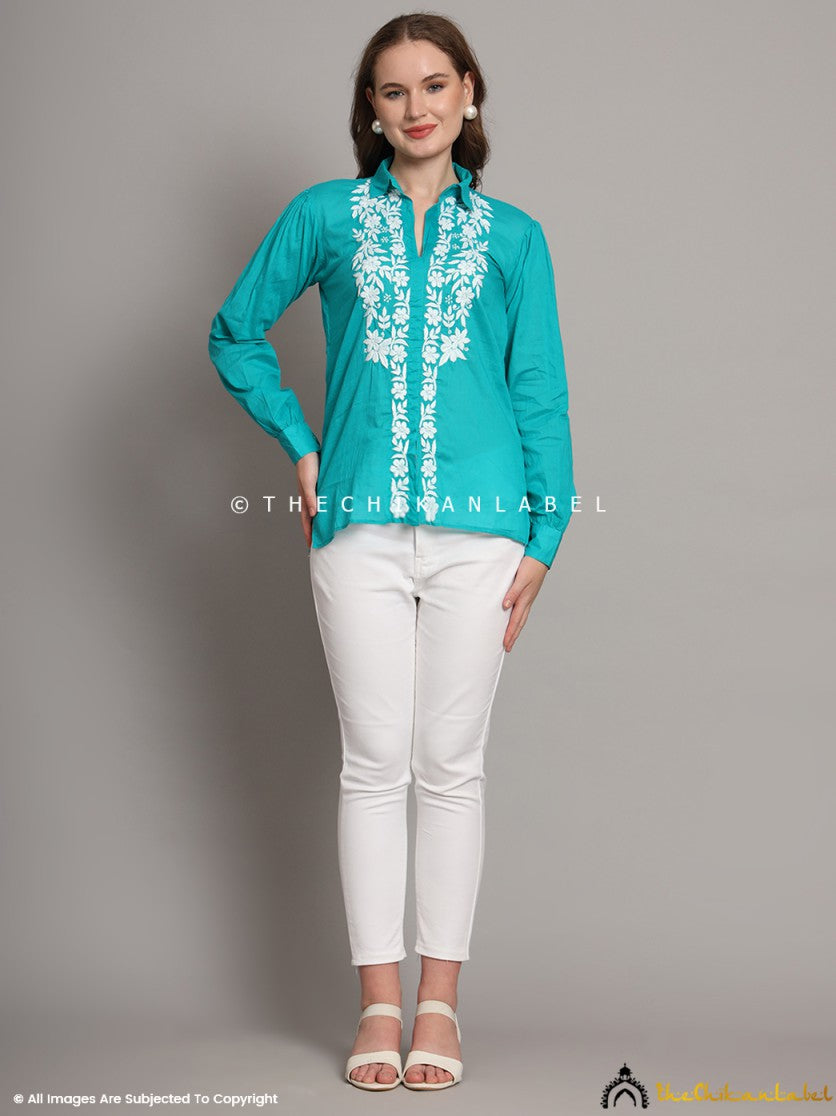 Woman wearing green mulmul cotton chikankari shirt with white embroidery