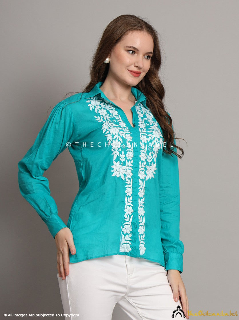 Rear view of relaxed-fit green shirt with hand embroidery