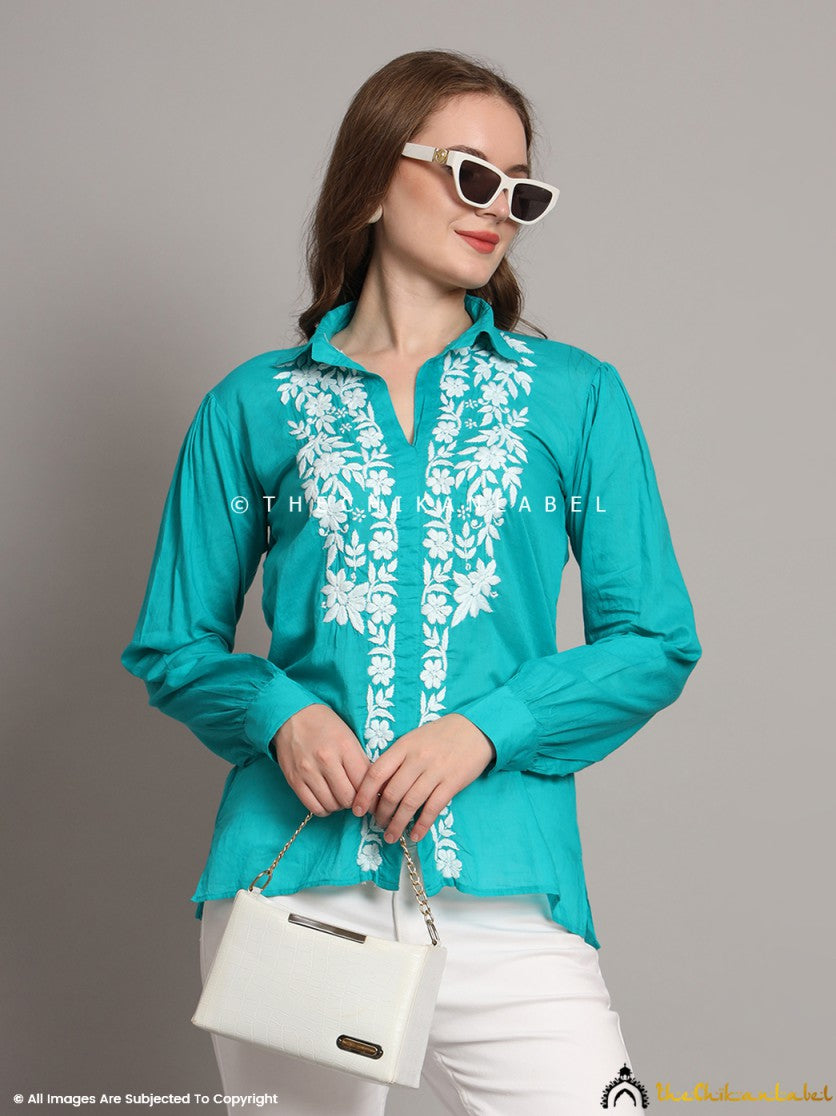 Green mulmul shirt styled open over a white cami