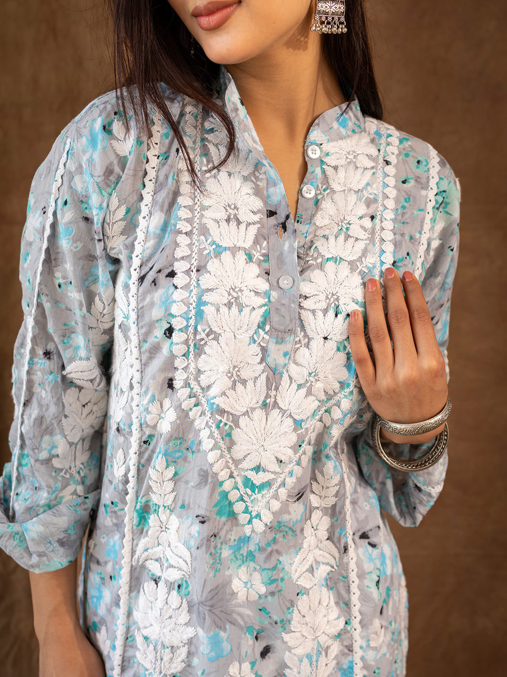 Handcrafted chikankari kurta set with detailed floral embroidery, styled with flowy farshi salwar for a graceful ethnic silhouette