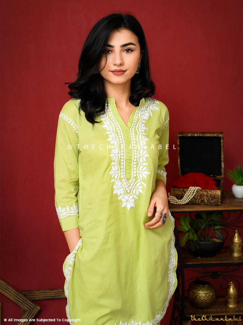 Hand-embroidered Rumi kurta set in fresh lime green, featuring classic white Chikankari patterns on soft breathable cotton fabric. Shop sustainable ethnic wear online.