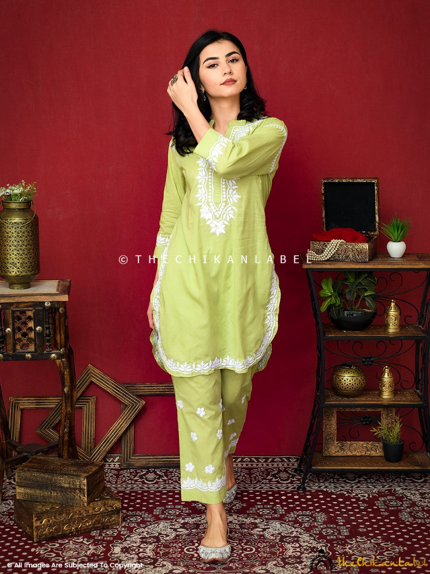 Shop handcrafted lime green Chikankari kurta and pant set—features delicate white threadwork, soft cotton base, and classic 3/4 sleeves.