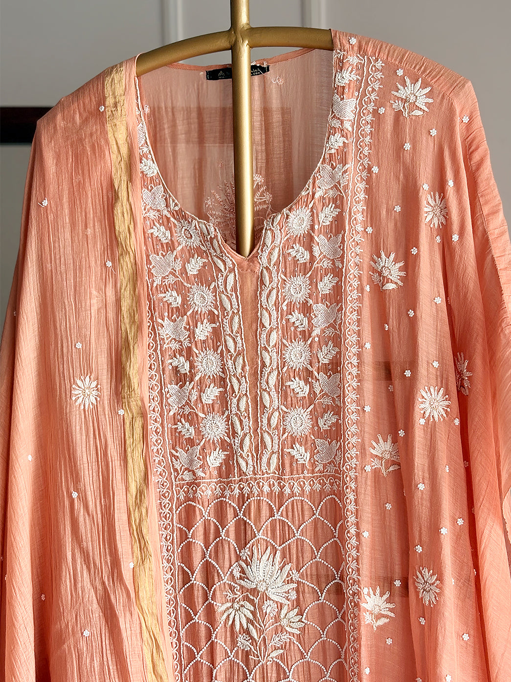 Luxe chikankari kurti fabric with traditional floral motifs and delicate embroidery patterns on soft Mulmul Chanderi