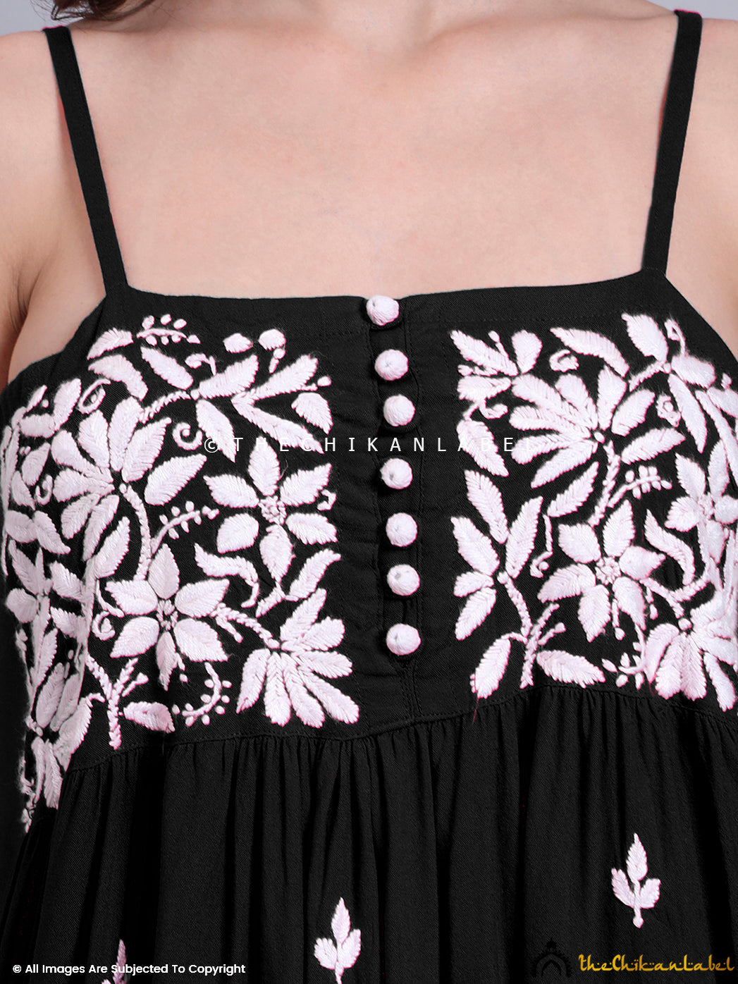 Traditional chikankari embroidery showcased on a flared modal top with peplum fit and relaxed silhouette for hot-weather dressing.