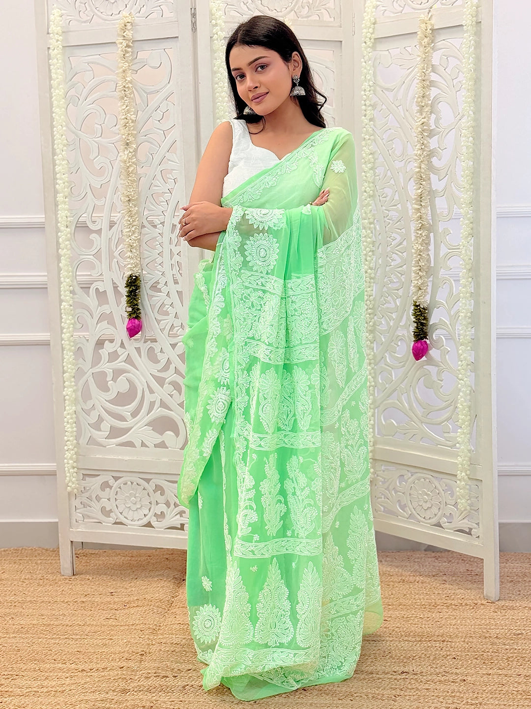 Artisanal chikankari saree showcasing timeless Lucknowi embroidery techniques on soft georgette material.