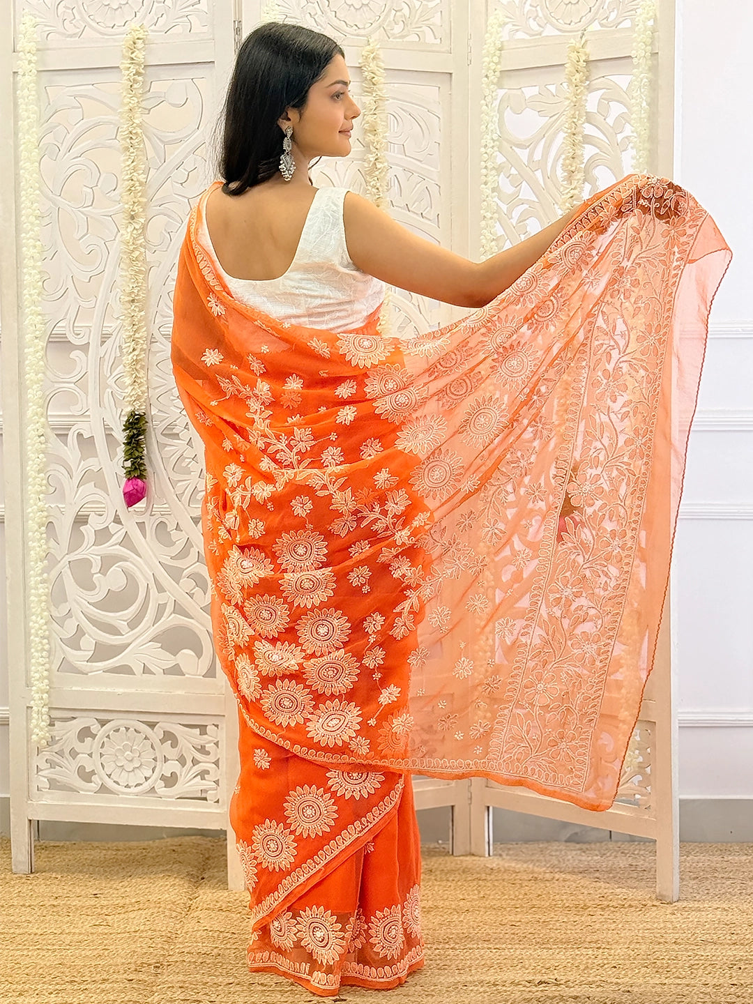 Festive wear chikankari saree featuring delicate thread embroidery and graceful drape for traditional occasions.