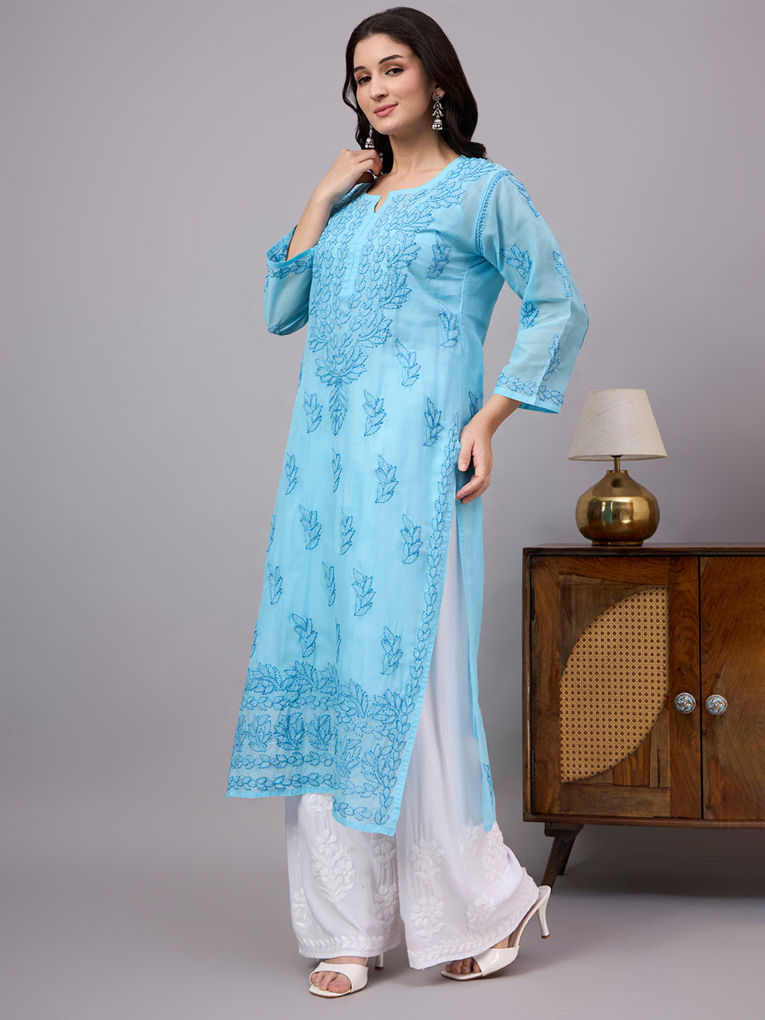 Women's handcrafted Cotton Straight Kurti with authentic floral Chikankari embroidery, comfortable regular fit, and breathable fabric for daily wear and festive occasions.