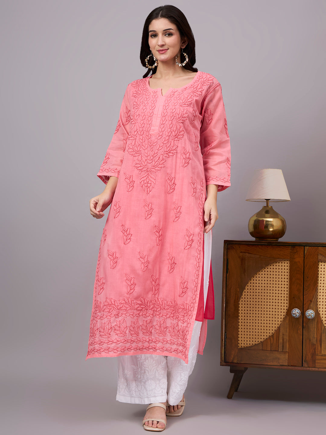 Authentic Cotton Straight Kurti designed with handcrafted floral Chikankari embroidery, breathable fabric, and an attached inner for all-day comfort.