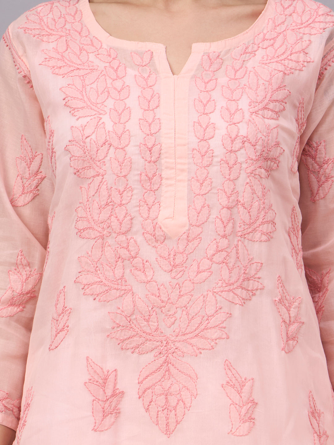 Authentic Cotton Straight Kurti designed with handcrafted floral Chikankari embroidery, breathable fabric, and an attached inner for all-day comfort.