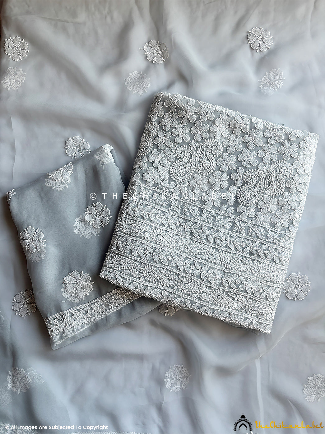 “Unstitched georgette chikankari suit piece with dupatta featuring traditional hand embroidery and floral motifs”