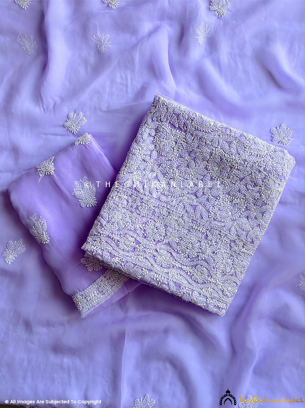 “Unstitched georgette chikankari suit piece with dupatta featuring traditional hand embroidery and floral motifs”